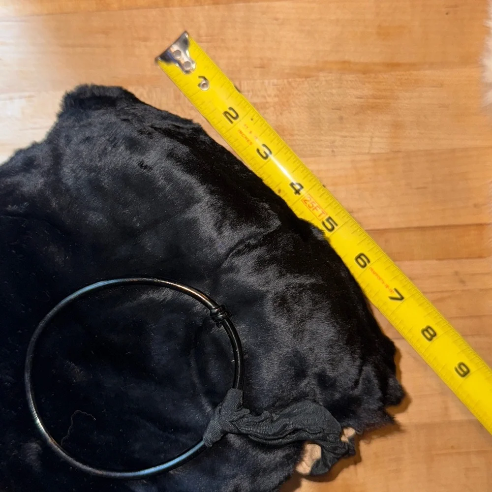 Vintage child’s seal fur muff hand warmer in black.